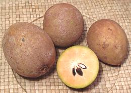 Whole and cut Sapodilla Fruit